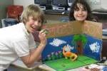 Young Teens Building Dinosaur Panorama
